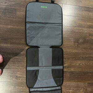 Gray and Black car seat protector for child seat.